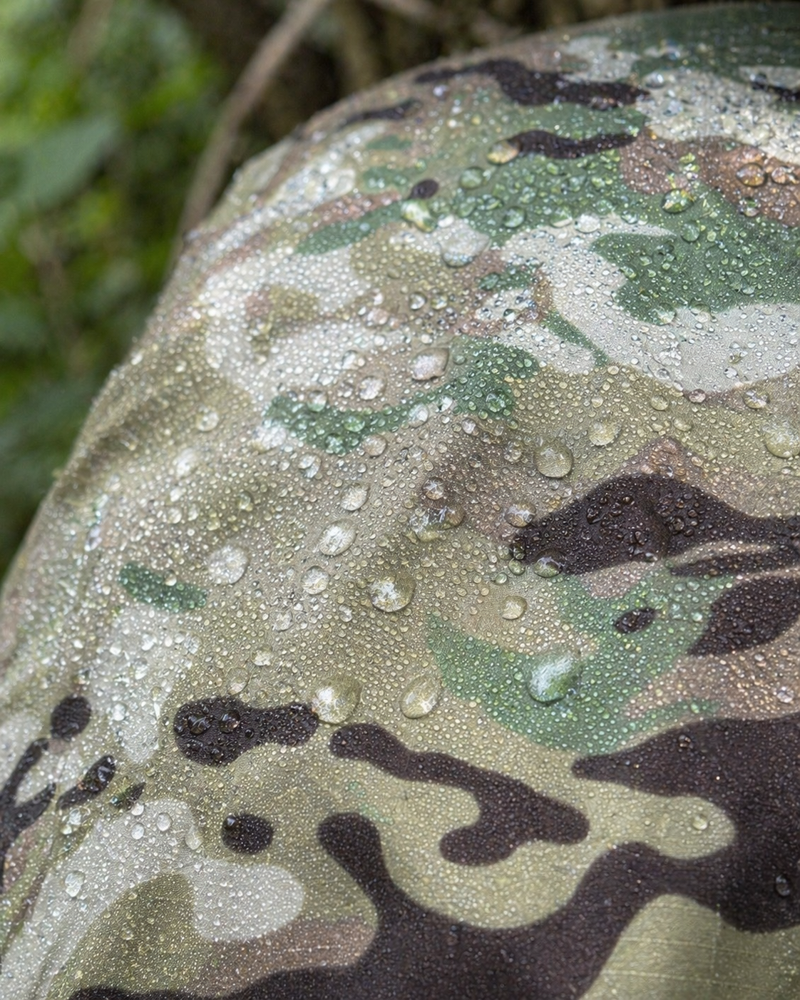 Rain beading on MultiCam OCP waterproof pack cover fabric - demonstrating weather-sealed construction